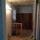 Modern bathroom renovation under construction, featuring drywall installation and electrical wiring, showcasing professional contracting services for home remodeling projects.