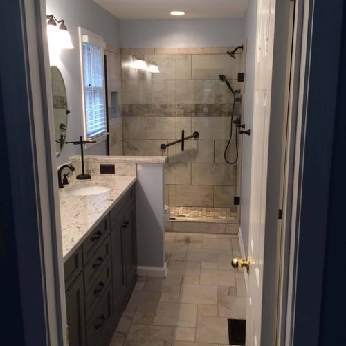 Bathroom renovation with modern tile shower, granite countertop vanity, and contemporary fixtures by My Contracting Guy. Expert local contractor specializing in bathroom upgrades and remodels.