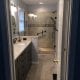Bathroom renovation with modern tile shower, granite countertop vanity, and contemporary fixtures by My Contracting Guy. Expert local contractor specializing in bathroom upgrades and remodels.
