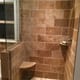 - Modern walk-in shower with natural stone tiles and glass enclosure for a luxurious bathroom upgrade.
