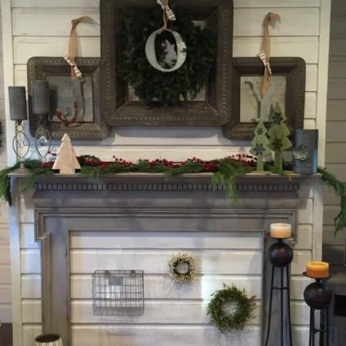Festive holiday fireplace decorations with wreaths, candles, and Christmas-themed accents creates a cozy, inviting Christmas home interior. Perfect for holiday decor and home improvement ideas.