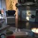 Festive living room decorated for Christmas featuring a lit Christmas tree, cozy armchair, and holiday wreaths, showcasing home decorating services by My Contracting Guy.