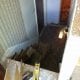 Newly renovated interior hallway under construction with exposed flooring and walls, featuring tools for home remodeling and repair by My Contracting Guy, specializing in residential renovations and contracting services.