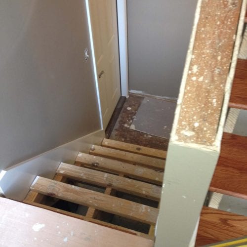 Loose stair treads under renovation, showcasing stair repair and remodeling services by My Contracting Guy.