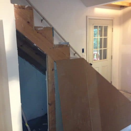 New staircase renovation in progress - custom carpentry and drywall installation by My Contracting Guy for home improvement projects.