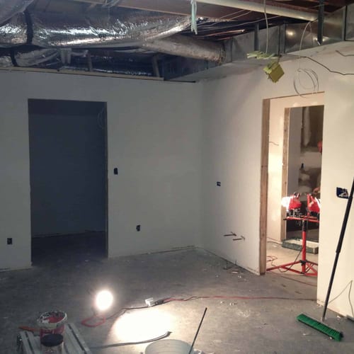 Newly renovated interior space under construction by My Contracting Guy, showcasing drywall installation, electrical wiring, and ongoing finishing work for residential or commercial contracting projects.