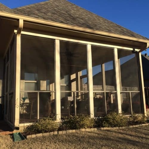 Beautiful screened-in porch extension showcasing professional contracting services for outdoor living improvements and home renovation projects.