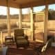 Spacious screened porch with outdoor seating overlooking a scenic countryside view, ideal for home remodeling, patio renovation, and outdoor living space improvements by My Contracting Guy.