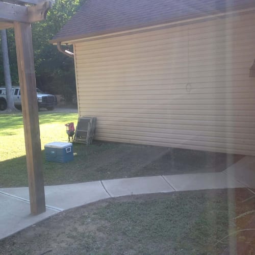 Newly installed wooden deck extension with a sturdy Post and a covered patio area by My Contracting Guy. Expert outdoor construction services for residential homes.